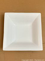 Top view of the deep square white ceramic serving dish showing shape and condition.