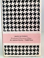 Close-up of bottom section of outer box showing 'Made in France' and Christian Dior address in Paris.