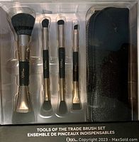 Front view of the boxed new Quo Tools of the Trade 4 piece double-ended makeup brush set with case.