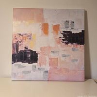 Front view of square canvas showing abstract brush strokes and blocks of pastel and dark colors.