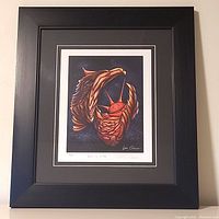 Full view of the framed Don Chase print featuring a stylized bird and sun artwork.