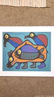 Full view of Norval Morrisseau print showing colorful animal and bird imagery.