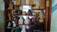 Wood display shelf with spaced figurines showing overall arrangement