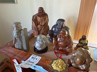 Overview of eight figurines and hanging ornament on table