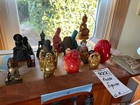 All figurines displayed on wooden bench
