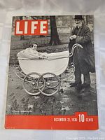 Front cover of the 1936 Life magazine issue showing elderly man and baby pram black and white photo.