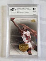 Front view of the 2009-10 Michael Jordan #45 Upper Deck Legacy Collection Gold graded card in protective casing, graded 10 Mint or Better by BCCG.