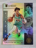 Front side of 2020 Ja Morant rookie card with holographic shine and player action photo.