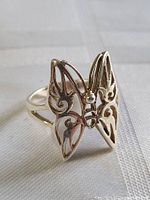 Front angle photo of sterling silver butterfly ring showing delicate open wing design.