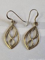 Front view of both sterling silver earrings showing the intricate Celtic knot design and shape.