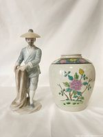 Photo showing both the porcelain figurine and floral urn side by side on a white backdrop