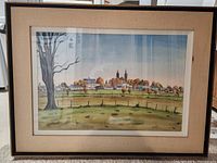 Front view of the framed watercolor painting depicting a country farmland with town in the background, showing detail of the landscape and frame.