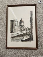 Front view of framed pen and ink drawing depicting Bon Secours Market in Old Montreal, showing detailed architectural elements and cobblestone street.
