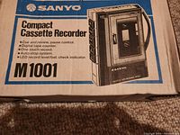 Original box of the Sanyo M1001 Compact Cassette Recorder showing model and features