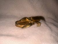 Top angle of the brass lobster ashtray showing the front claw and body details.