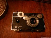Front angled photo of Argus vintage camera with lens and control dials visible.