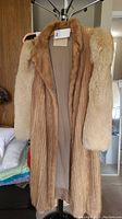 Full front view of vintage Burkholder ribbed mink coat with fox fur sleeves showing natural fur colors and inner lining.
