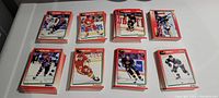 Image showing multiple stacks of 1991 Score NHL cards arranged on a table with visible red borders and various player images.