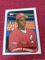 Front side of Curt Ford baseball card showing him in St. Louis Cardinals uniform in stadium setting.