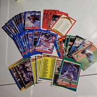 Many assorted Donruss MLB baseball cards spread on a flat surface, featuring players from 1988 to 1991.