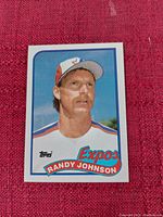 Front side of the Randy Johnson Expos baseball card featuring player's portrait and team details.