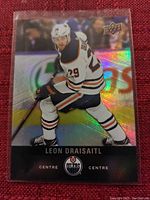 Clear photo of the Leon Draisaitl Edmonton Oilers hockey card showing holographic background and player skating image.