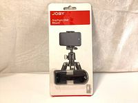 Front view of Joby GripTight ONE Mount in original packaging showing product and branding.