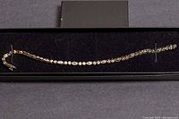 Full bracelet in display box showing length and design