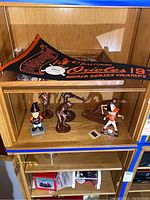 Overall display showing multiple Baltimore Orioles themed figurines and a black and orange 1971 World Series Champions pennant flag.