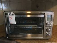 Front view of stainless steel Hamilton Beach toaster oven with air fryer function, model 31193, showing closed front door and control panel on the right side.