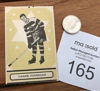 Front of 1933-34 OPC Frank Finnegan hockey card showing player in Ottawa Senators uniform with stick, against yellow star background. Card has pin hole through top center visible.