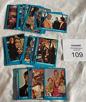 Photo showing multiple Partridge Family trading cards front side with colorful, sharp images and blue borders.