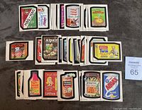 Full overview of 46 Wacky Packages cards laid out and grouped in rows, showing front colorful satirical images parodying popular brand products.