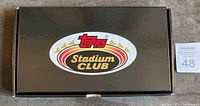 Closed black box featuring Topps Stadium Club logo on top