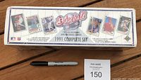 Box of the 1991 Upper Deck Baseball Card Sealed Factory Set with the original sealed plastic wrap, showing front and sides with product branding and images of sample cards.