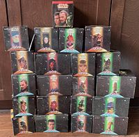 Photo showing all 21 sealed Star Wars Episode 1 Burger King Happy Meal toy boxes arranged in a pyramid with a larger display box at the top center.