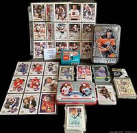 Photo showing full lot with hockey cards spread out including sets and tins
