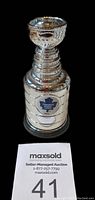 Single miniature Stanley Cup showing the Toronto Maple Leafs logo on the front.
