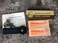 Photo showing the honing guide & angle jig with three sharpening stones from Lee Valley in original packaging.