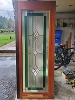 Full front view of mahogany door with decorative glass showing size proportions and colors.