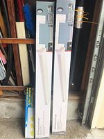 Two boxed LED wraparound lights and one boxed 18-inch fluorescent under cabinet light.