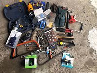 Overview of miscellaneous tools including pliers, wire brush, hacksaw, fabric tool holder, flashlight, measuring tape, and other accessories.