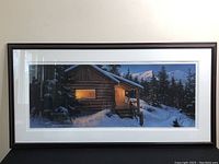 Full front view of the framed print showing the dark wood frame and artwork