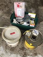 Overview of electrical spools, box with electrical accessories, switch package, and connectors.