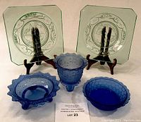 Five-piece glassware set with 2 green square plates and 3 blue bowls including Shirley Temple piece