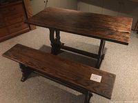 Photo of solid oak dining table and matching bench set showing top and leg design