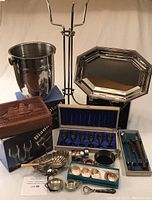 Full set of barware and glassware including ice bucket, tray, glasses, napkin holders, bar tools, and cigar box