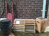 Wide angle showing entire lot including lobster cage, sled, barrel and ceramic propane heater.