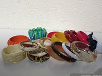 Photo showing assorted vintage bangle bracelets laid in rows