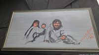 Full view of framed original painting by Brigid Zimmer depicting three figures in traditional clothing on gray background